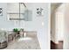 Charming bathroom with granite countertop, decorative mirror, and updated lighting at 1484 Cherry St, Denver, CO 80220