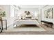 Tranquil bedroom featuring modern decor, a decorative rug, and ample natural light at 1484 Cherry St, Denver, CO 80220