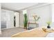 Minimalist bedroom with large closet, neutral decor, and contemporary artwork at 1484 Cherry St, Denver, CO 80220