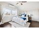Bright bedroom with a ceiling fan and large windows, creating a cozy and inviting atmosphere at 1484 Cherry St, Denver, CO 80220