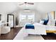 Relaxing bedroom featuring a ceiling fan, lots of natural light, and tasteful decor at 1484 Cherry St, Denver, CO 80220