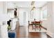 Bright dining area with modern lighting, wood table, and open access to the kitchen at 1484 Cherry St, Denver, CO 80220