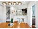 Inviting dining room featuring a modern light fixture and an open view of the stylish kitchen at 1484 Cherry St, Denver, CO 80220