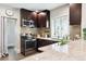 This updated kitchen has stainless steel appliances, granite countertops, and a stylish backsplash at 1484 Cherry St, Denver, CO 80220