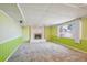 Basement featuring a fireplace and a large window at 14259 W Virginia Dr, Lakewood, CO 80228