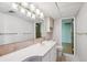 A cozy bathroom features neutral colored walls and tile floors at 14259 W Virginia Dr, Lakewood, CO 80228