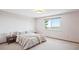 Bedroom with large window and neutral color palette at 14259 W Virginia Dr, Lakewood, CO 80228