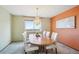 Chic dining room featuring a chandelier over a wooden table that seats six next to a window at 14259 W Virginia Dr, Lakewood, CO 80228