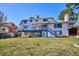 Spacious home featuring a backyard deck and a large, grassy backyard at 14259 W Virginia Dr, Lakewood, CO 80228