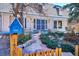 Inviting front yard with stone pathway leading to the entrance of the beautiful two-story home at 14259 W Virginia Dr, Lakewood, CO 80228