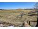 Hillside view from a rustic wooden staircase leading to a large field at 14259 W Virginia Dr, Lakewood, CO 80228
