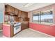 Kitchen with oak cabinets and classic appliances at 14259 W Virginia Dr, Lakewood, CO 80228