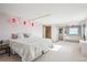 Bright main bedroom with an attached bathroom featuring a soaking tub at 14259 W Virginia Dr, Lakewood, CO 80228