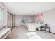 Spacious main bedroom featuring soft pink walls and an abundance of natural light at 14259 W Virginia Dr, Lakewood, CO 80228
