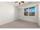 Empty bedroom with neutral carpet, large window and plenty of natural light at 9633 E 5Th Ave # 10208, Denver, CO 80230