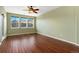 Spacious living area with wood flooring and plenty of natural light from the windows and glass panel door at 9633 E 5Th Ave # 10208, Denver, CO 80230