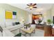Open concept living room with hardwood floors, recessed lighting, and a comfortable seating area at 9633 E 5Th Ave # 10208, Denver, CO 80230