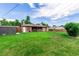 Spacious backyard with lush green lawn, privacy fence and shed at 3334 W Grand Ave, Englewood, CO 80110