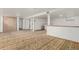 Large finished basement featuring wood accents and an open floor plan at 3334 W Grand Ave, Englewood, CO 80110