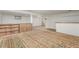 Finished basement with carpeting, shelving, and a small window providing natural light at 3334 W Grand Ave, Englewood, CO 80110