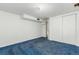 Cozy bedroom with blue carpeting, white walls, and a closet, providing a comfortable space at 3334 W Grand Ave, Englewood, CO 80110