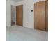 Bedroom with closet, neutral walls, baseboard trim and carpet flooring at 3334 W Grand Ave, Englewood, CO 80110