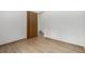 Bedroom with hardwood floors, baseboard trim, a closet and a window at 3334 W Grand Ave, Englewood, CO 80110