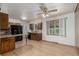 View of a spacious kitchen with wooden cabinetry, granite countertops, and hardwood flooring at 3334 W Grand Ave, Englewood, CO 80110