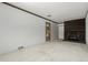 Bright living room with white brick walls, dark brick fireplace, and carpeted floors at 3334 W Grand Ave, Englewood, CO 80110