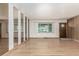 Spacious living room boasting hardwood floors, wall mirrors and natural light at 3334 W Grand Ave, Englewood, CO 80110