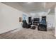 Finished basement with carpet, a drop ceiling, and a comfortable seating area with recliners at 3937 S Truckee St, Aurora, CO 80013