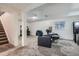 Finished basement featuring neutral carpet, white walls, and two comfortable leather armchairs with side table at 3937 S Truckee St, Aurora, CO 80013