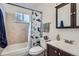 Well-maintained bathroom with neutral tile and updated fixtures at 3937 S Truckee St, Aurora, CO 80013