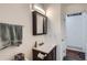 Clean bathroom features updated vanity and lighting at 3937 S Truckee St, Aurora, CO 80013