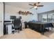 Spacious bedroom with modern decor, a large window, and a ceiling fan at 3937 S Truckee St, Aurora, CO 80013