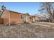 View of a neutral colored single-story home with an attached garage and a small front yard at 3937 S Truckee St, Aurora, CO 80013