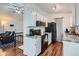 Modern kitchen features white cabinets, granite countertops, and stainless steel appliances at 3937 S Truckee St, Aurora, CO 80013