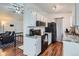 Functional kitchen space with white cabinets, laminate countertops, and black appliances at 3937 S Truckee St, Aurora, CO 80013