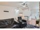 Comfortable living room featuring hardwood floors, a ceiling fan and neutral paint at 3937 S Truckee St, Aurora, CO 80013