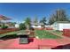 Large fenced-in backyard with a patio, fire pit, and plenty of space for outdoor entertaining at 2401 W Jewell Ave, Denver, CO 80219