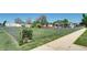 Large backyard with partial chain link fence and some landscaping, offering ample space for outdoor activities at 2401 W Jewell Ave, Denver, CO 80219
