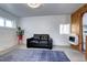 Bright basement with a cozy couch, large windows, and minimalist decor for a comfortable living space at 2401 W Jewell Ave, Denver, CO 80219