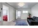 Well-lit and spacious, with an easy flow into the bedroom space and an exit to the backyard at 2401 W Jewell Ave, Denver, CO 80219