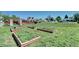 View of yard featuring several raised garden beds in a spacious lot with plenty of room to garden at 2401 W Jewell Ave, Denver, CO 80219