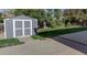 Spacious backyard features a well-maintained lawn, patio, and storage shed at 331 Las Lomas St, Brighton, CO 80601