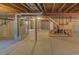 Spacious unfinished basement with exposed ductwork and concrete flooring at 331 Las Lomas St, Brighton, CO 80601