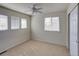 Bright bedroom with carpet, ceiling fan, and windows at 331 Las Lomas St, Brighton, CO 80601