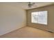 This is a bedroom with a neutral carpet, one window, and a ceiling fan at 331 Las Lomas St, Brighton, CO 80601