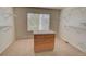 Spacious walk-in closet with neutral carpet, wooden drawers, and metal shelving at 331 Las Lomas St, Brighton, CO 80601