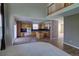 Open kitchen with an island, built-in oven, and access to a living space at 331 Las Lomas St, Brighton, CO 80601